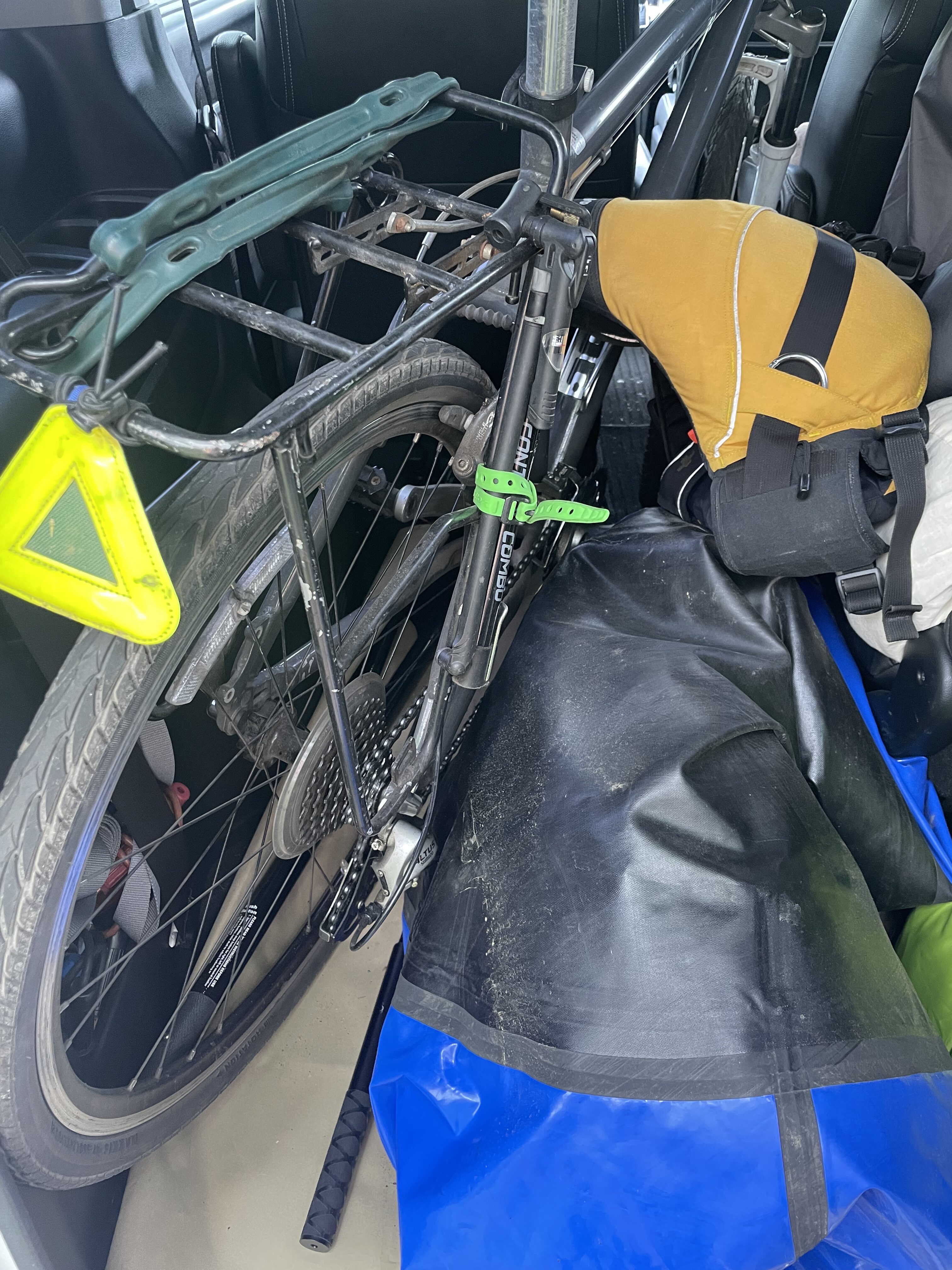 Packing the bike into the packraft, seen from inside the car
