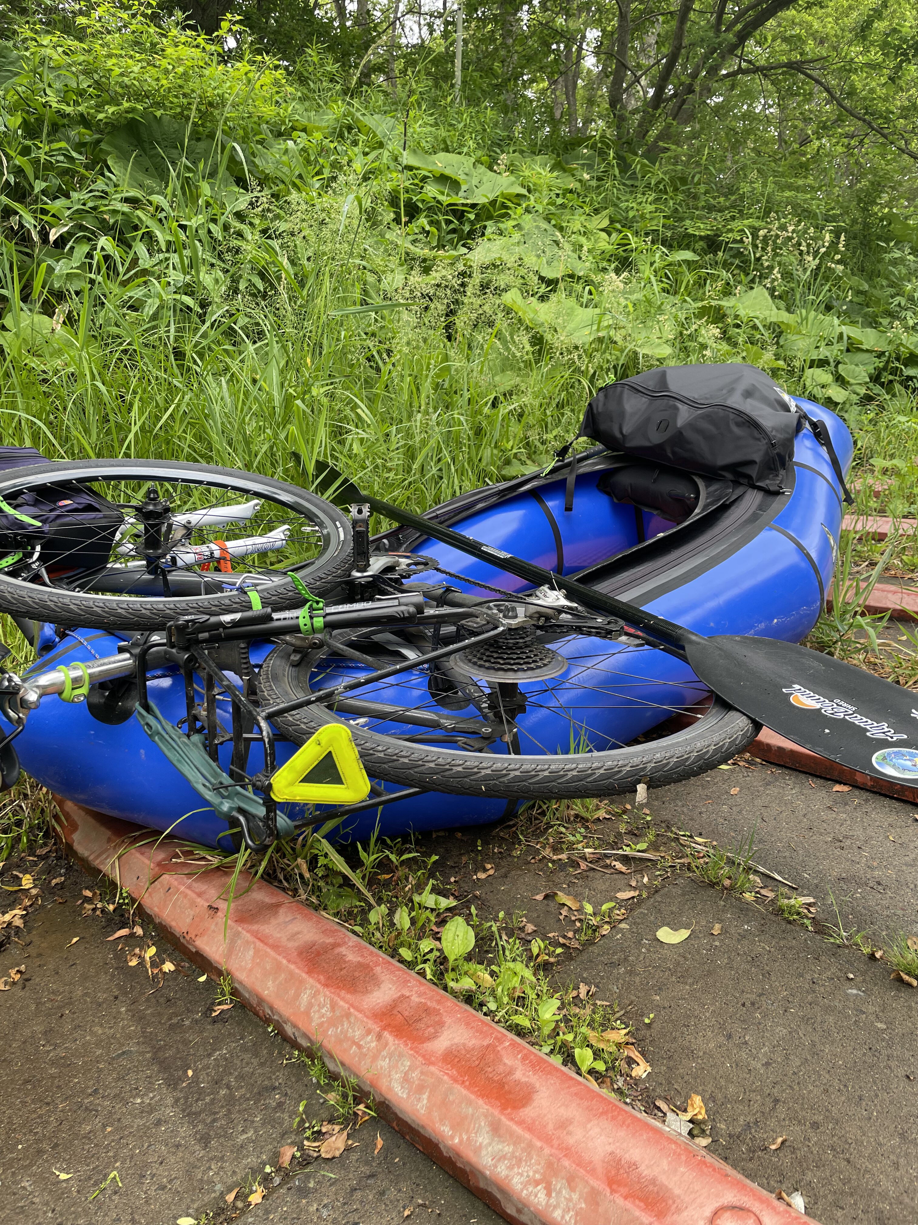 Strapping the disassembled bike to the hull