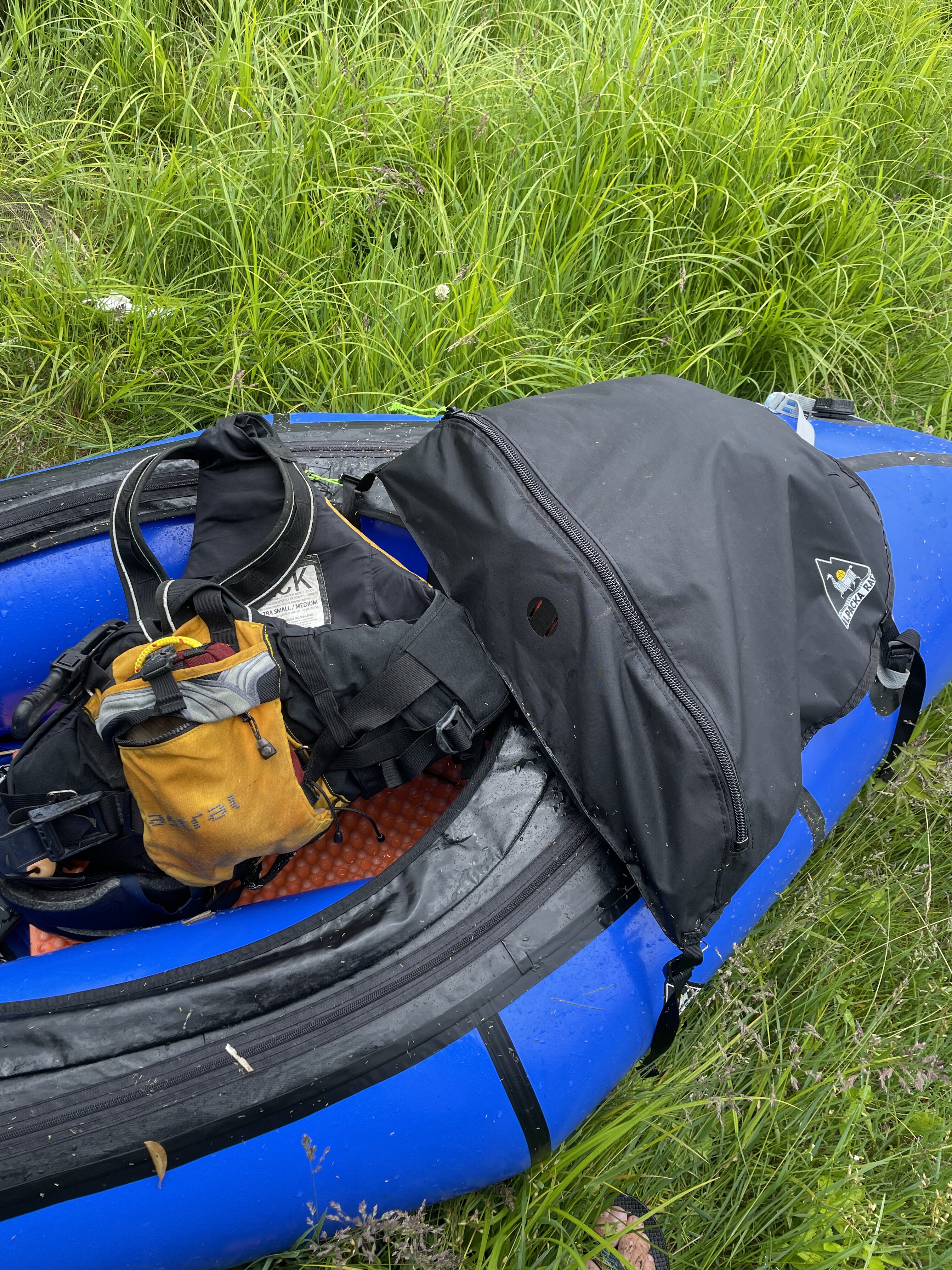 Portaging around a weir — the closed-cell foam pad visible as a seat