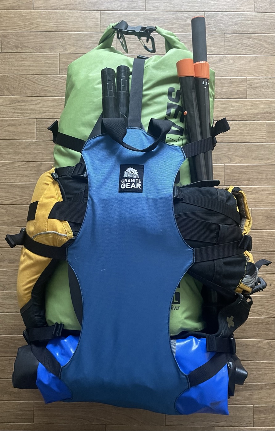 Packraft overnight gear packed into a backpack