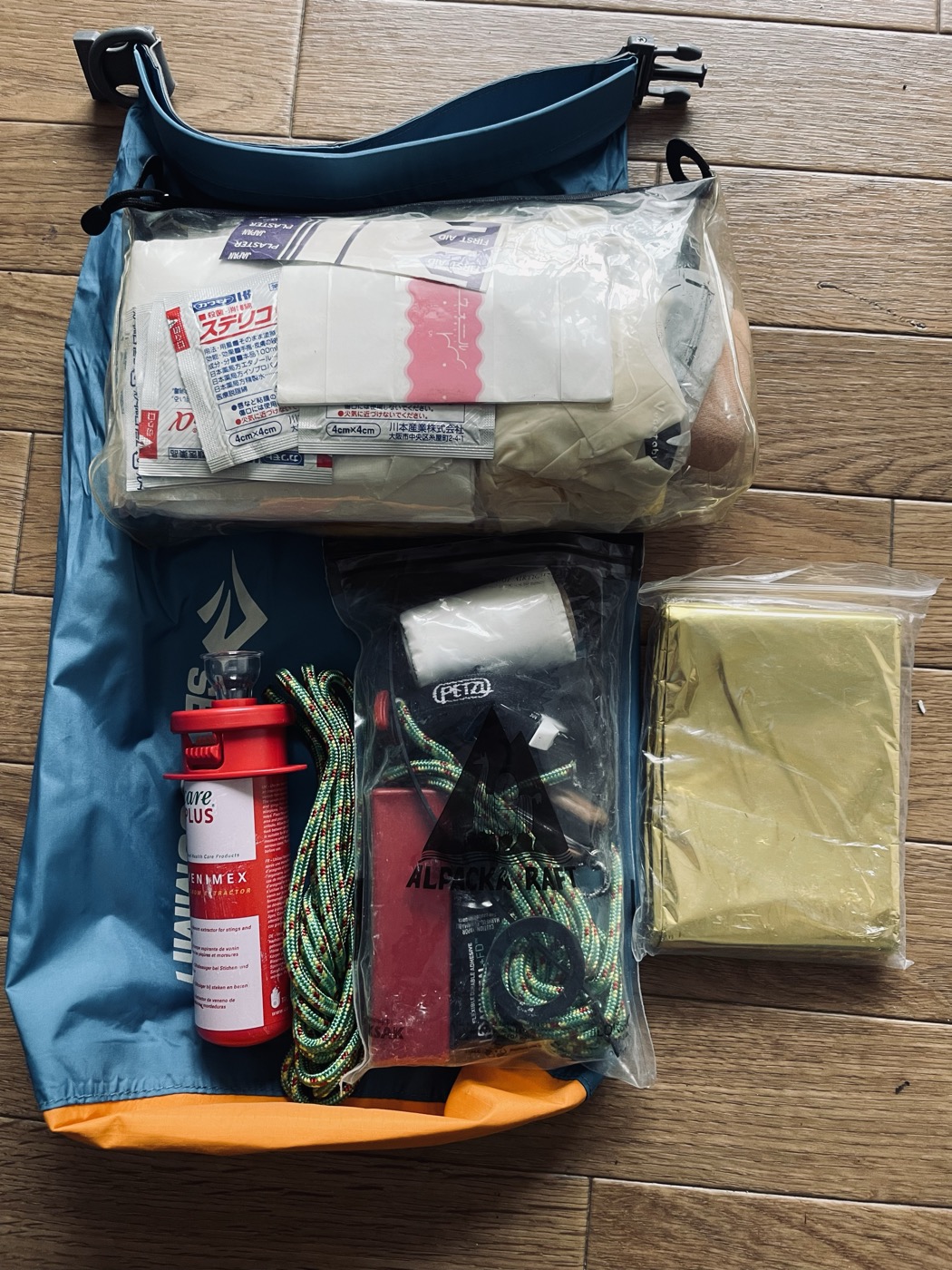 First aid and repair kit for packrafting